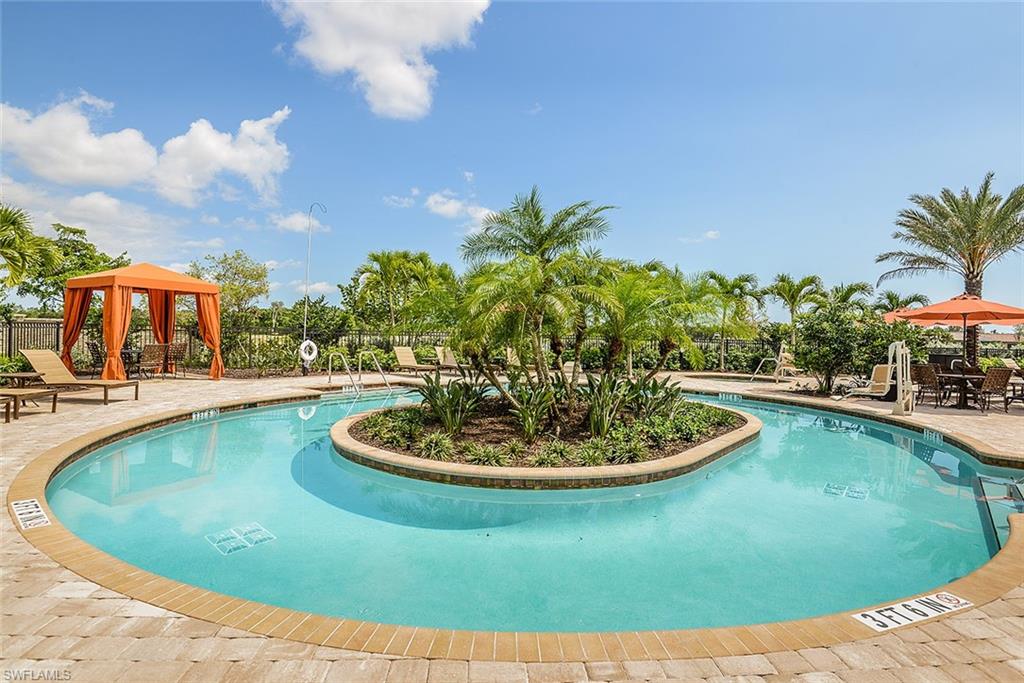 8558 Maggiore Court Naples, FL 34114 - Photo 23 of 32 a view of a swimming pool with a yard