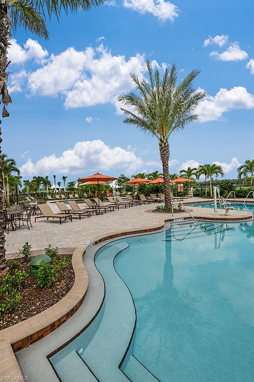 8558 Maggiore Court Naples, FL 34114 - Photo 24 of 32 a view of a lake with a house