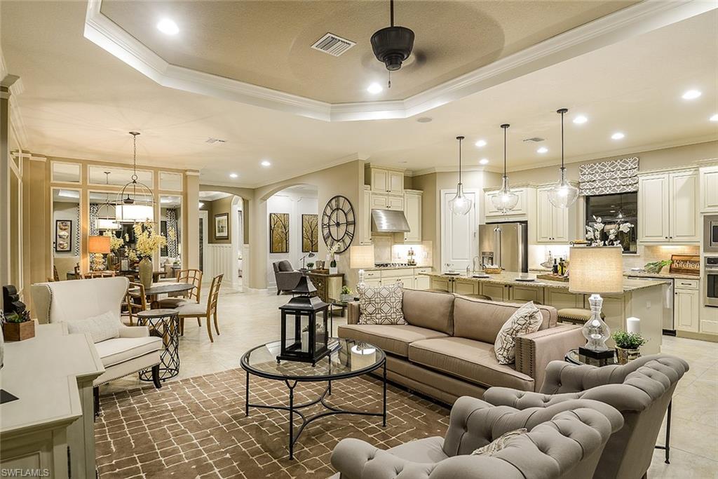 8558 Maggiore Court Naples, FL 34114 - Photo 4 of 32 a living room with furniture kitchen view and a chandelier