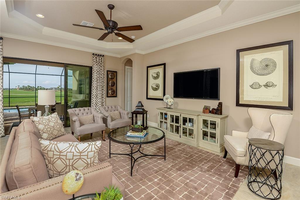 8558 Maggiore Court Naples, FL 34114 - Photo 6 of 32 a living room with furniture and a flat screen tv