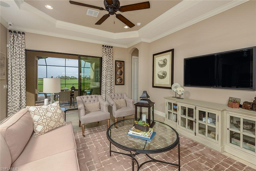 8558 Maggiore Court Naples, FL 34114 - Photo 7 of 32 a living room with furniture and a flat screen tv