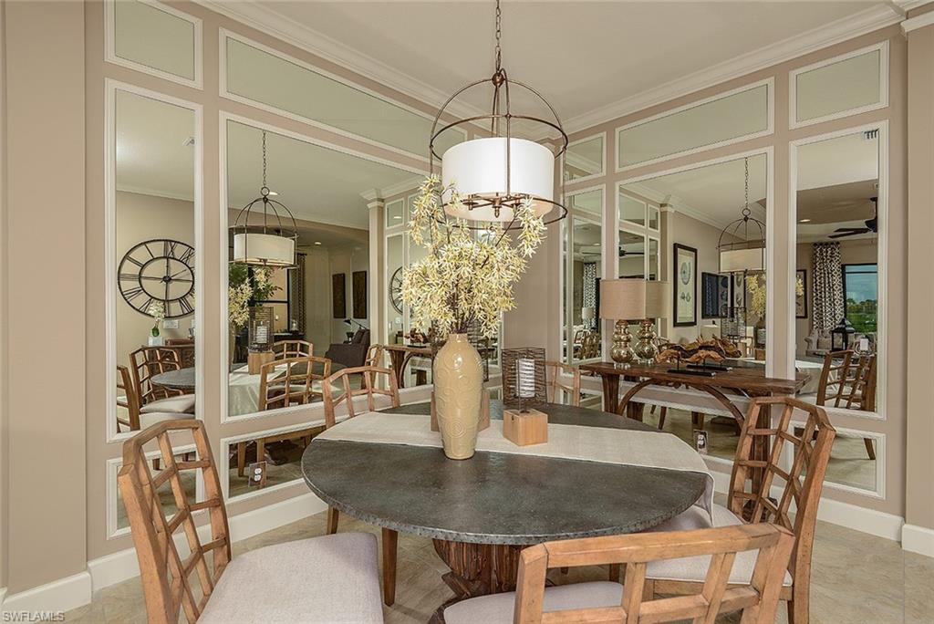8558 Maggiore Court Naples, FL 34114 - Photo 8 of 32 a view of a dining room with furniture window and outside view