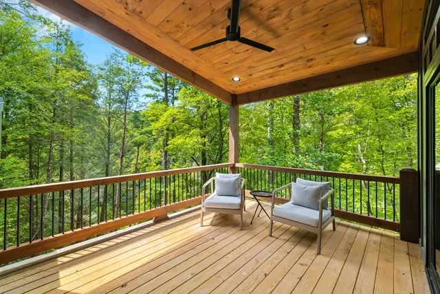a view of a two chairs in the balcony