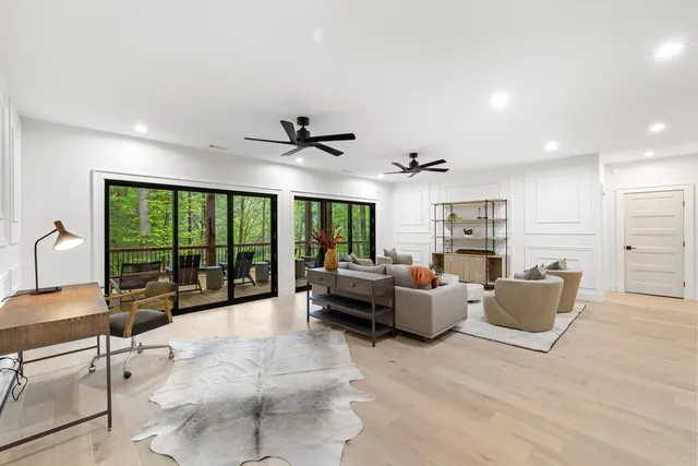 a spacious bedroom with a large bed and a large window