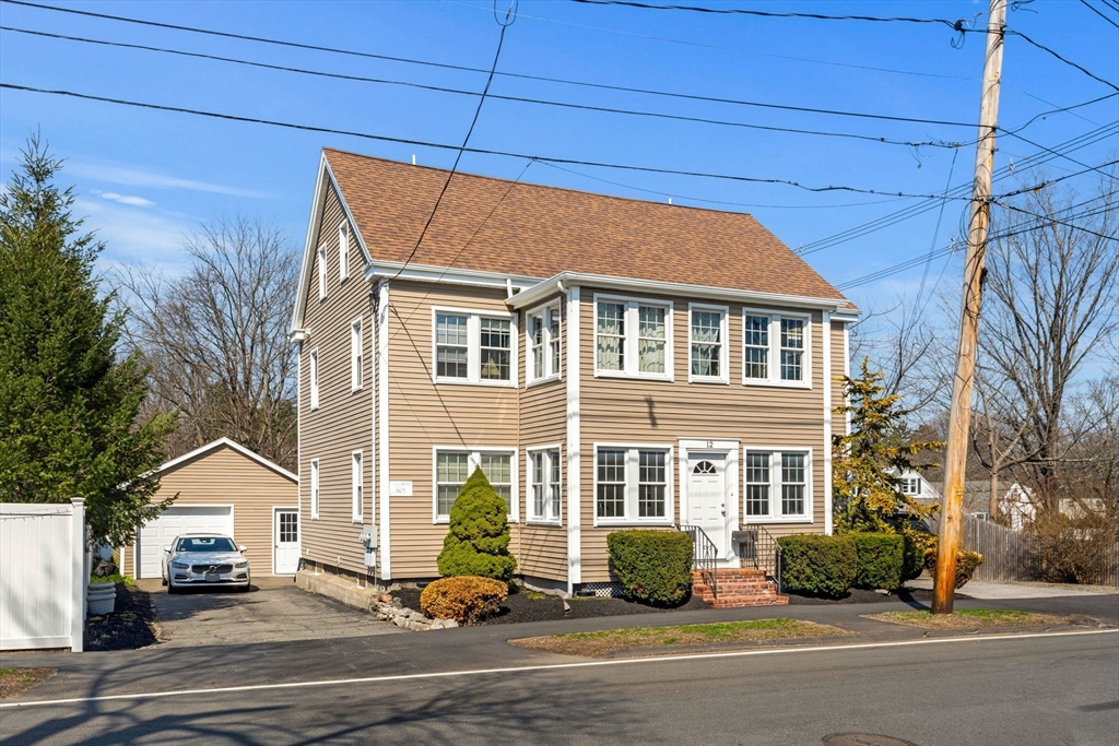 12 Chestnut Street Danvers, MA 01923 - Photo 1 of 37 a front view of a house with a yard