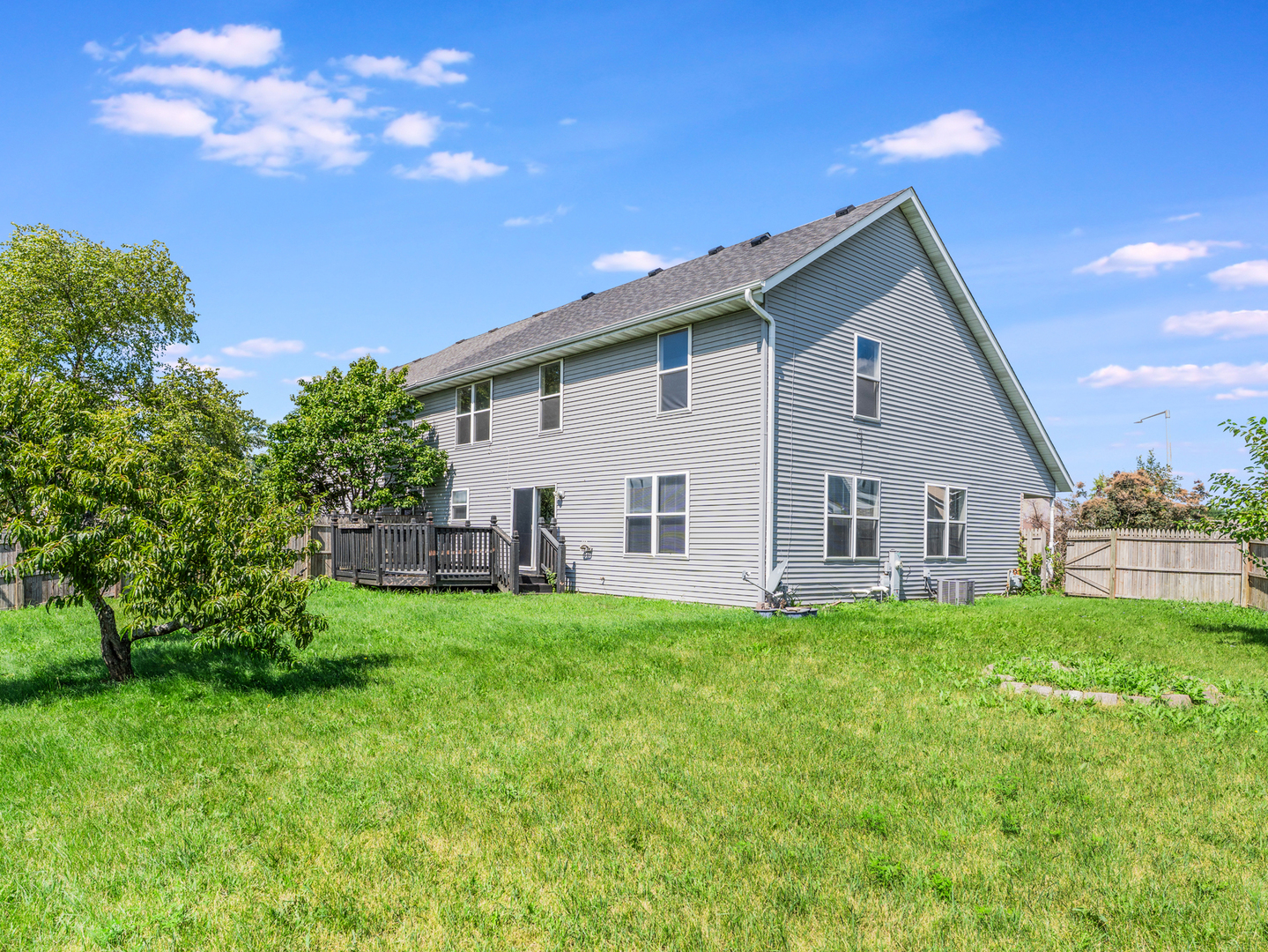 2433 Caton Crest Court Crest Hill, IL 60403 - Photo 17 of 18 a view of a house with a yard