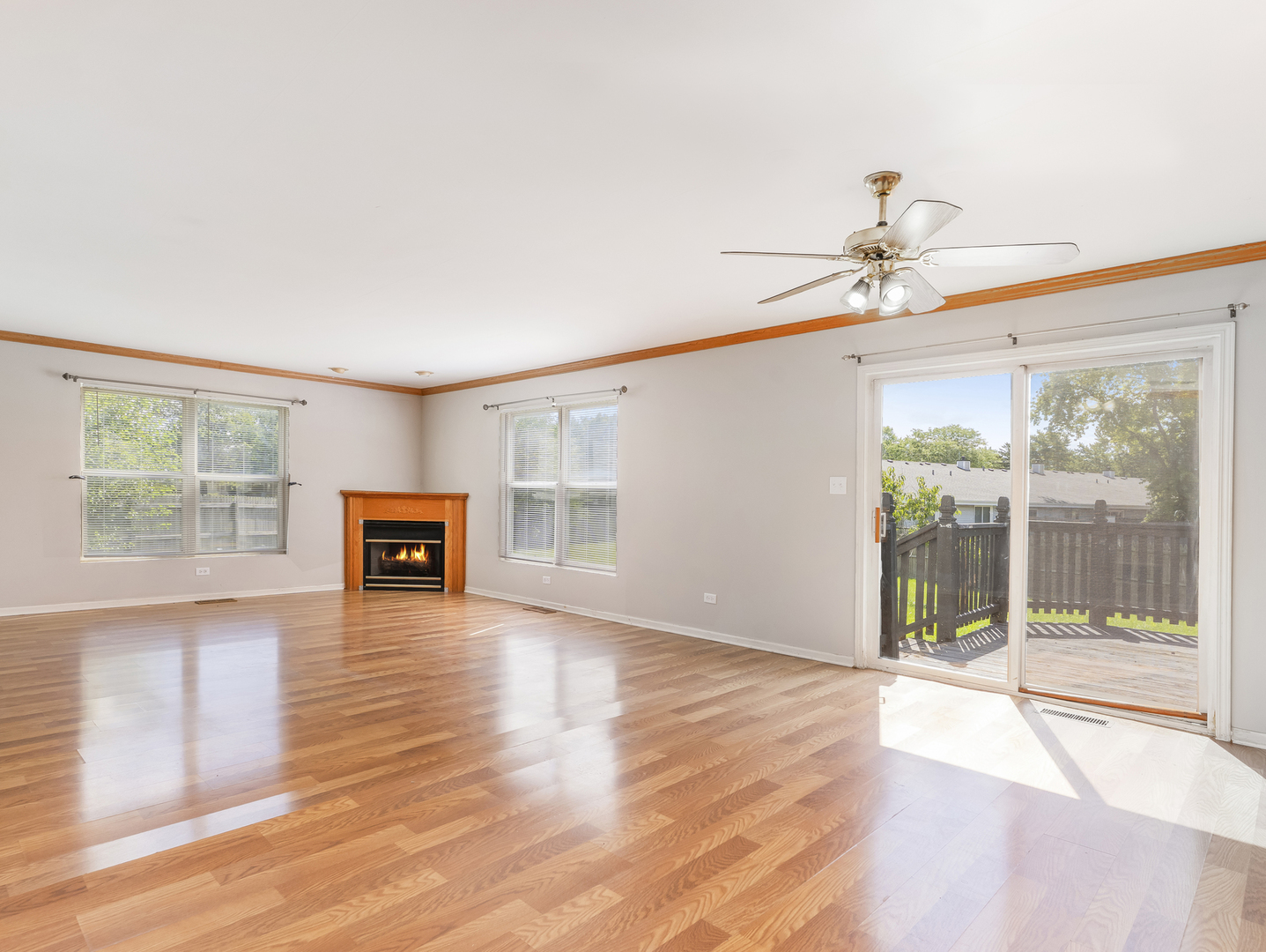 2433 Caton Crest Court Crest Hill, IL 60403 - Photo 5 of 18 a view of an empty room with wooden floor and a window