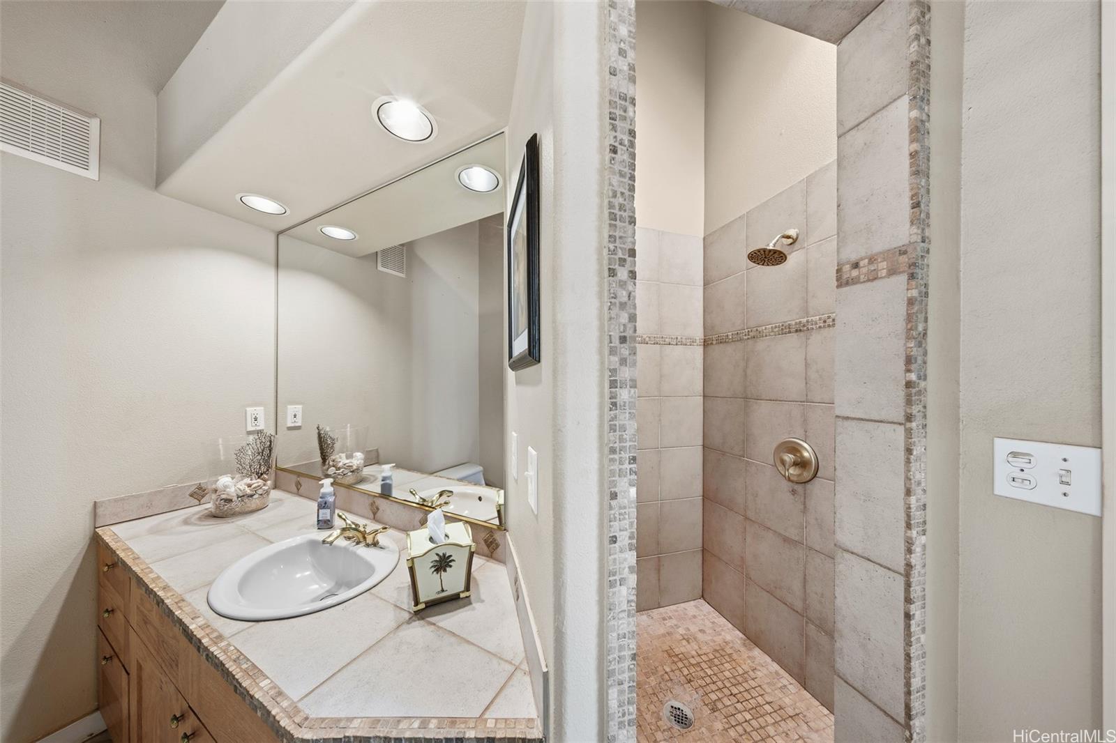 4720 Pohakuloa Road Maunaloa, HI 96770 - Photo 14 of 20 a bathroom with a sink double vanity and shower