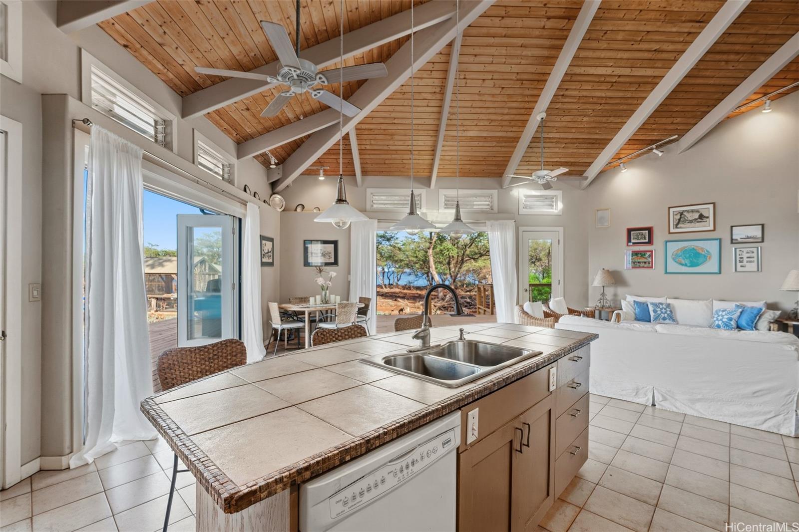 4720 Pohakuloa Road Maunaloa, HI 96770 - Photo 8 of 20 a kitchen with a sink a counter top space and living room view