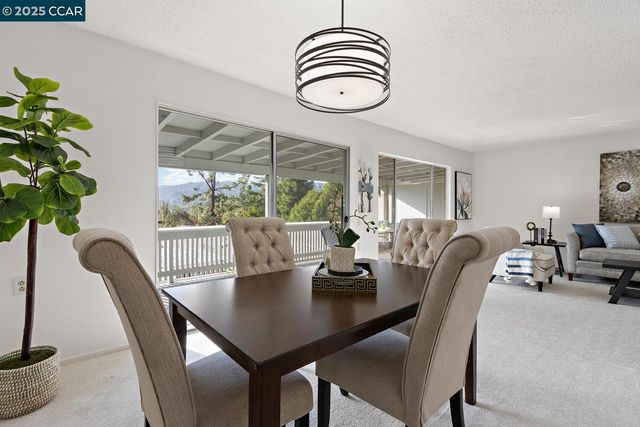 a kitchen with cabinets and stainless steel appliances