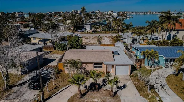 an aerial view of multiple houses with yard