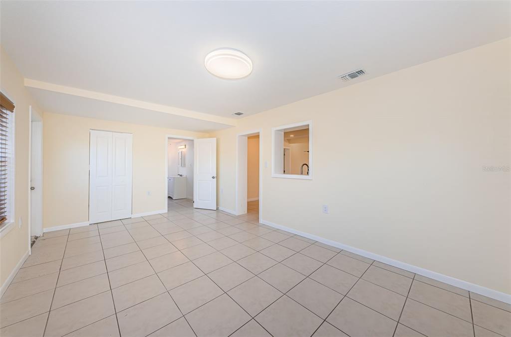 713 Pruitt Drive Madeira Beach, FL 33708 - Photo 20 of 62 a view of an empty room with window