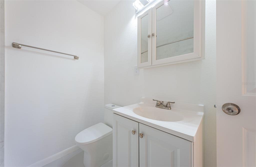 713 Pruitt Drive Madeira Beach, FL 33708 - Photo 31 of 62 a bathroom with a sink and mirror