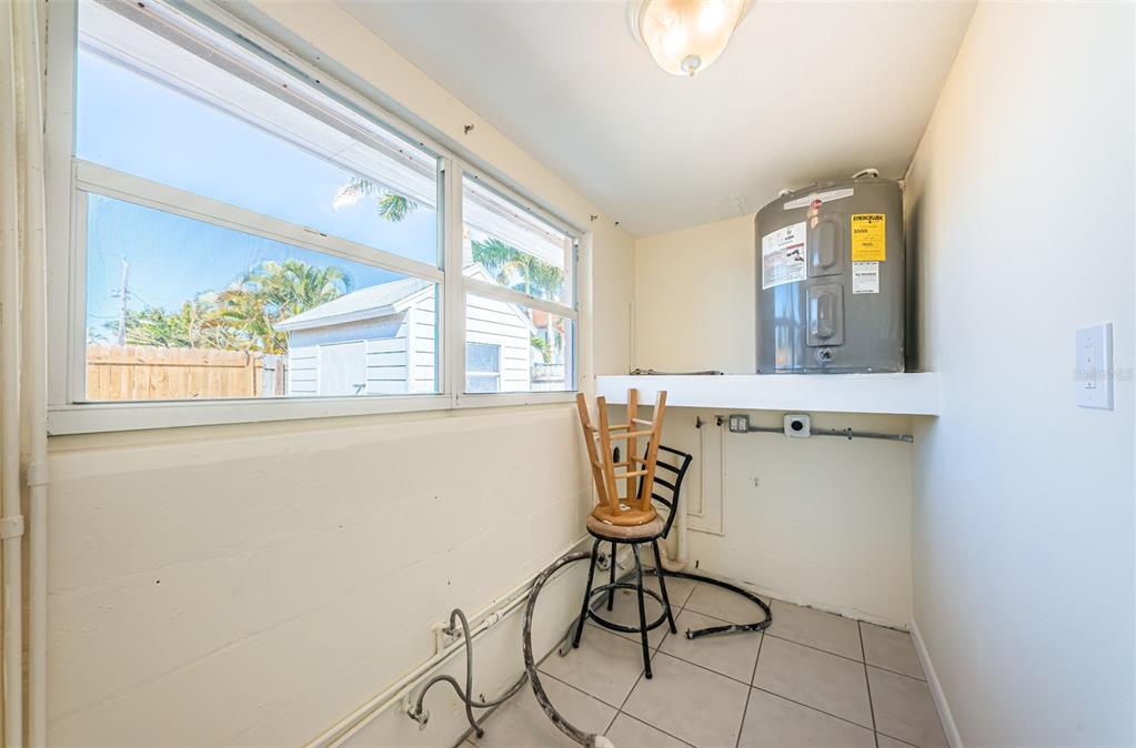 713 Pruitt Drive Madeira Beach, FL 33708 - Photo 34 of 62 a view of a door and chair in the room