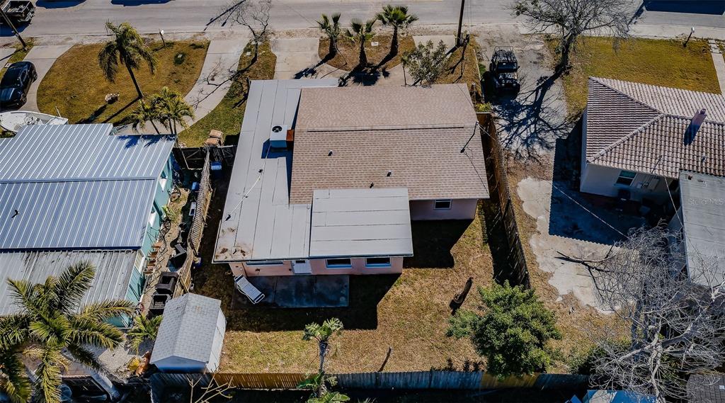 713 Pruitt Drive Madeira Beach, FL 33708 - Photo 35 of 62 an aerial view of a house with a yard