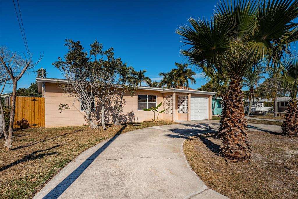 713 Pruitt Drive Madeira Beach, FL 33708 - Photo 42 of 62 a view of a house with a patio