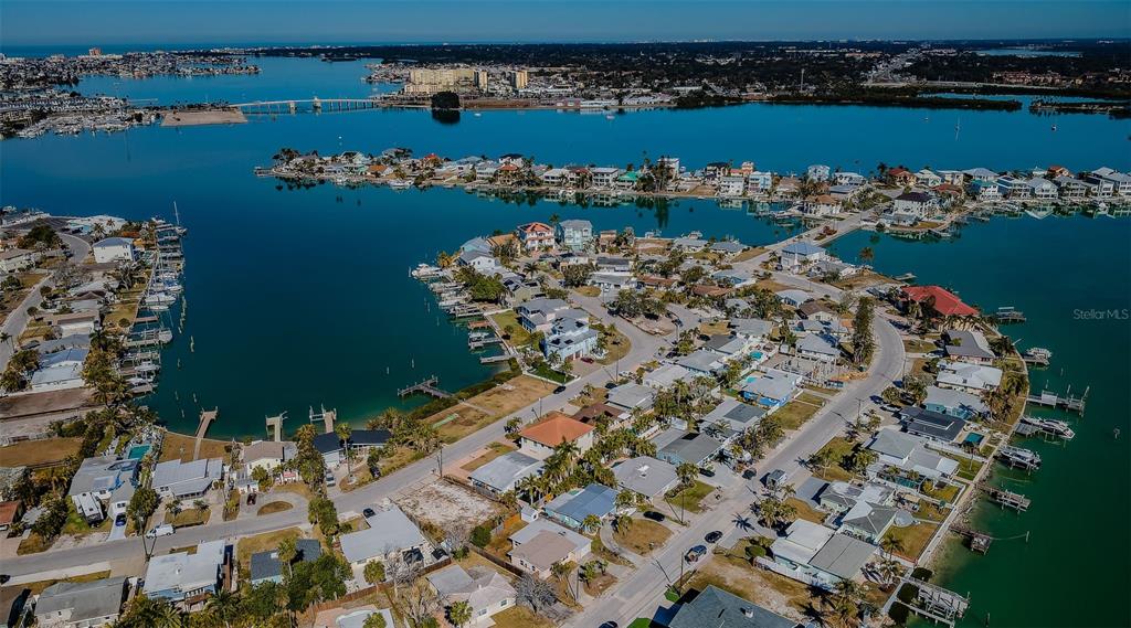713 Pruitt Drive Madeira Beach, FL 33708 - Photo 48 of 62 an aerial view of a house with a lake view