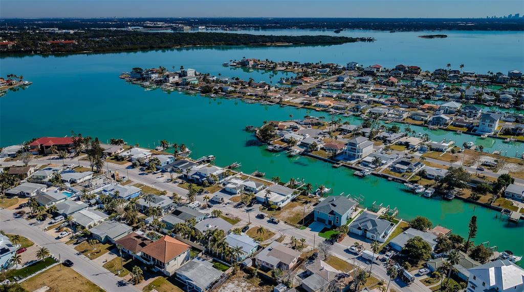 713 Pruitt Drive Madeira Beach, FL 33708 - Photo 50 of 62 an aerial view of a houses with a lake view