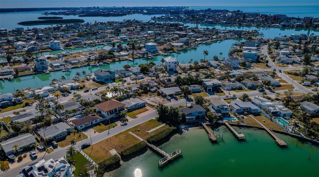 713 Pruitt Drive Madeira Beach, FL 33708 - Photo 60 of 62 an aerial view of a house with a yard
