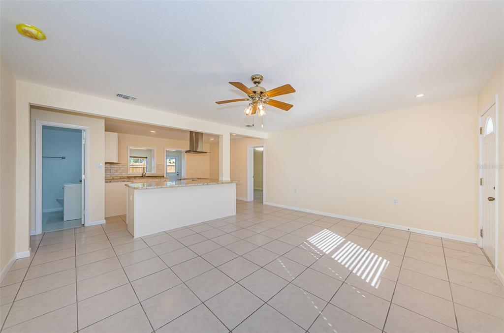 713 Pruitt Drive Madeira Beach, FL 33708 - Photo 6 of 62 a view of an empty room with a kitchen