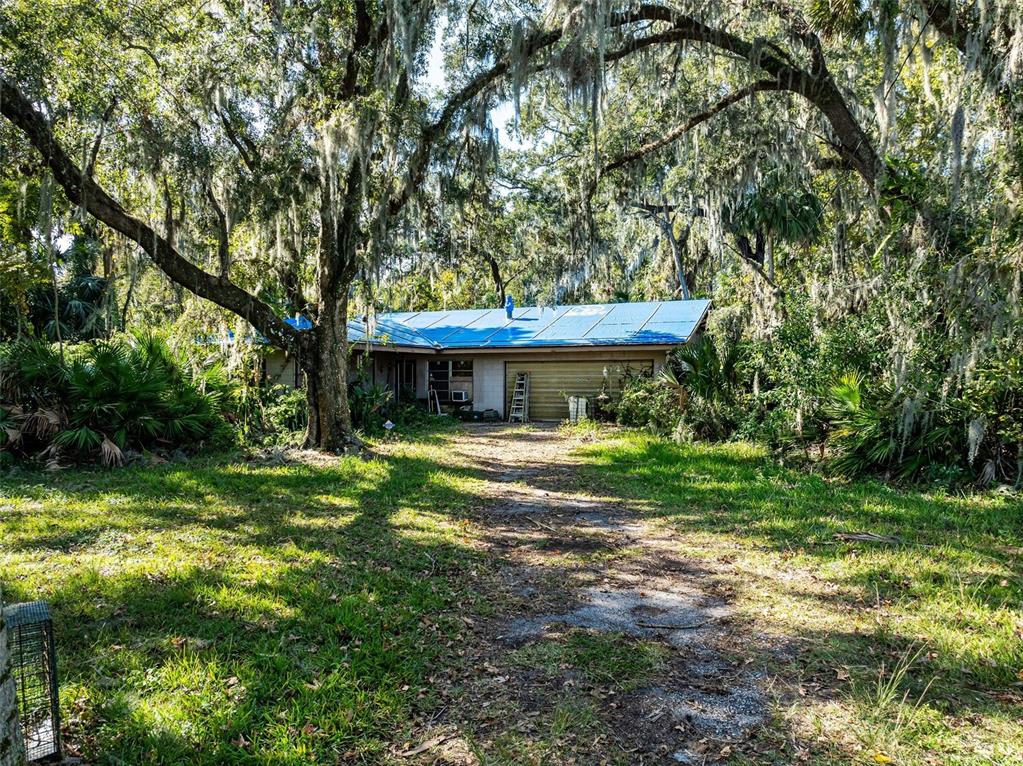 420 Monroe Road Sanford, FL 32771 - Photo 5 of 28 a front view of a house with a yard