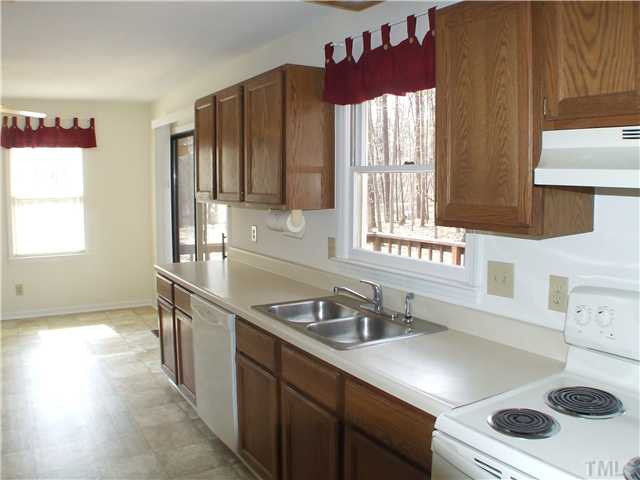 5520 Middleton Road Durham, NC 27713 - Photo 4 of 10 a kitchen that has a sink and a stove