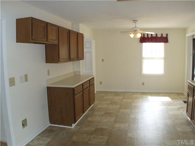5520 Middleton Road Durham, NC 27713 - Photo 5 of 10 a kitchen with cabinets and window