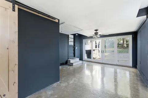 a view of room with a ceiling fan