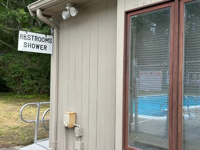 a front view of a house with garden and porch
