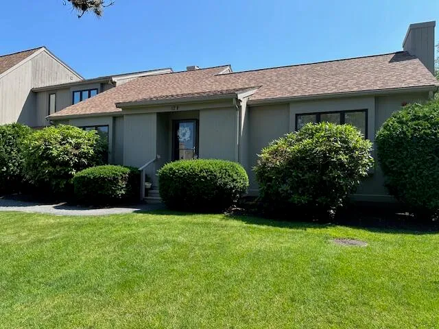 a street sign that is on a wooden wall