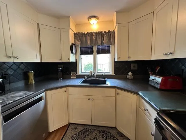 a kitchen with a sink and cabinets