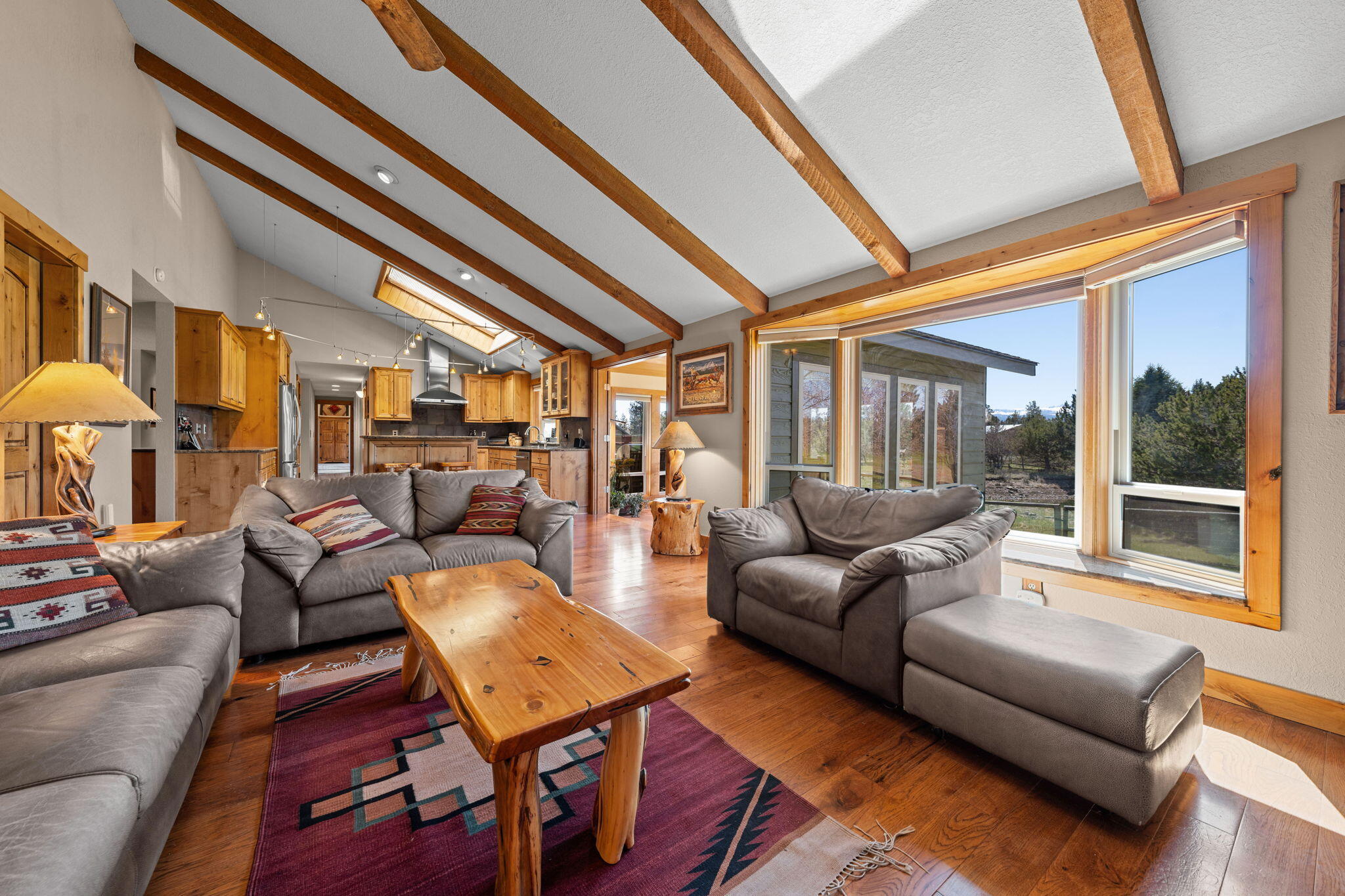 17375 Jordan Road Sisters, OR 97759 - Photo 28 of 63 Vaulten ceiling, exposed beams, huge bay windows. All new windows in 2023.