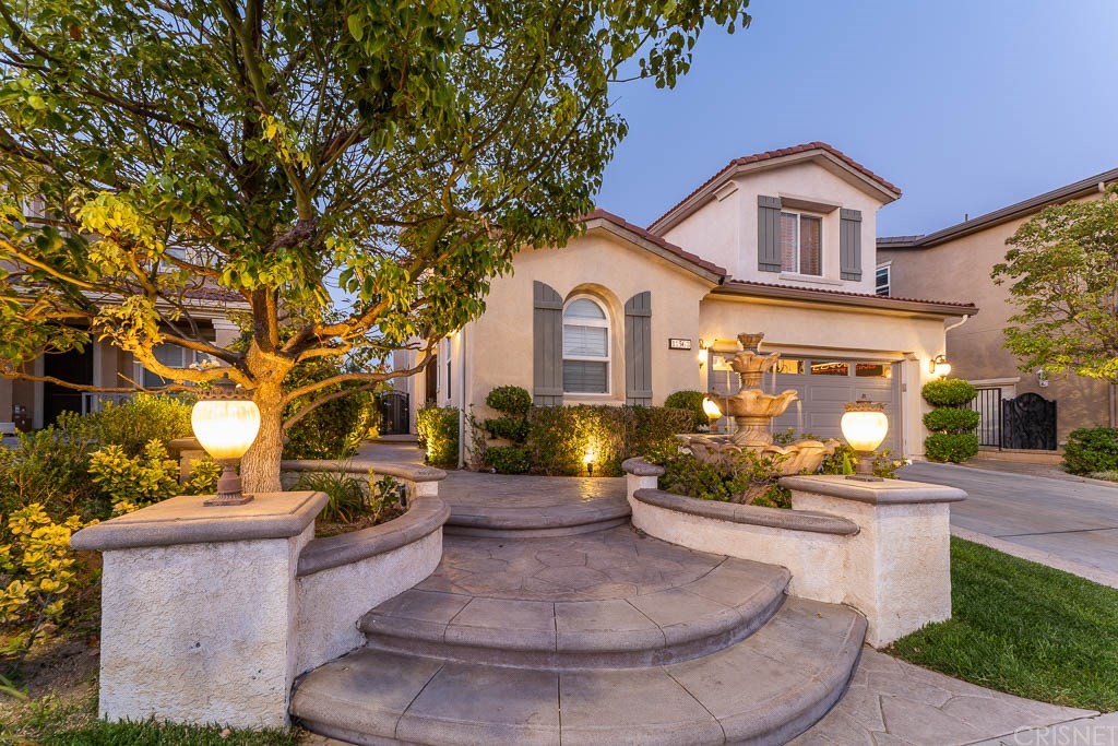 11568 Apulia Court Porter Ranch, CA 91326 - Photo 1 of 1 a view of a house with a fountain and a fire pit