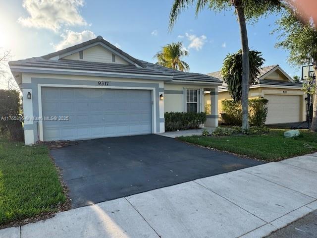 9317 Arborwood Circle Davie, FL 33328 - Photo 1 of 24 front view of a house