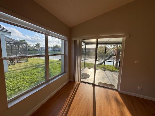 9317 Arborwood Circle Davie, FL 33328 - Photo 11 of 24 a view of a room with wooden floor and a bed