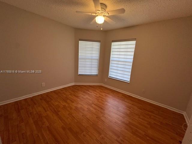 9317 Arborwood Circle Davie, FL 33328 - Photo 15 of 24 wooden floor in an empty room with a window