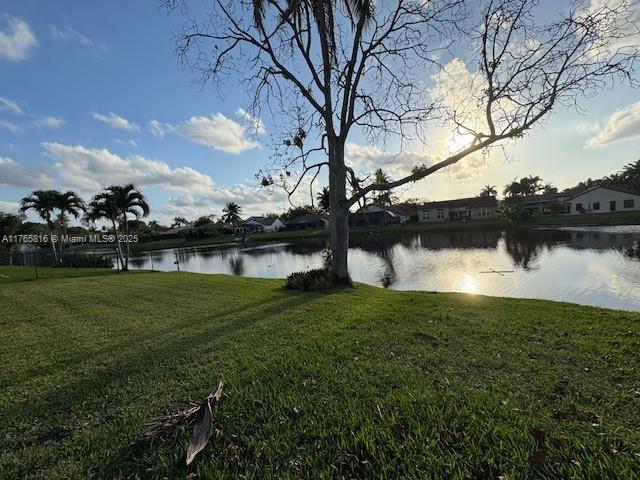 9317 Arborwood Circle Davie, FL 33328 - Photo 24 of 24 a view of a lake with houses in the background