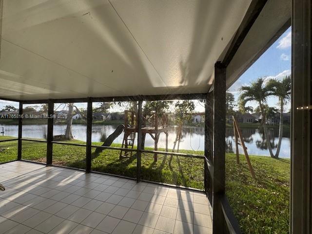 9317 Arborwood Circle Davie, FL 33328 - Photo 4 of 24 a view of porch with a floor to ceiling window next to a yard
