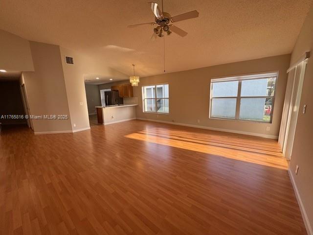 9317 Arborwood Circle Davie, FL 33328 - Photo 8 of 24 an empty room with wooden floor and windows
