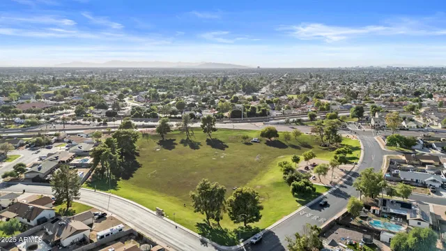 an aerial view of houses with an outdoor space