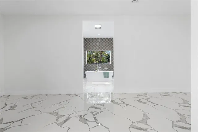 a view of a bathroom with a sink and a window