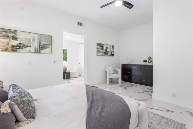 a bedroom with a bed and a television