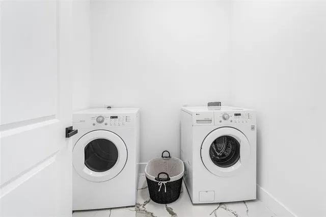 a utility room with dryer and washer