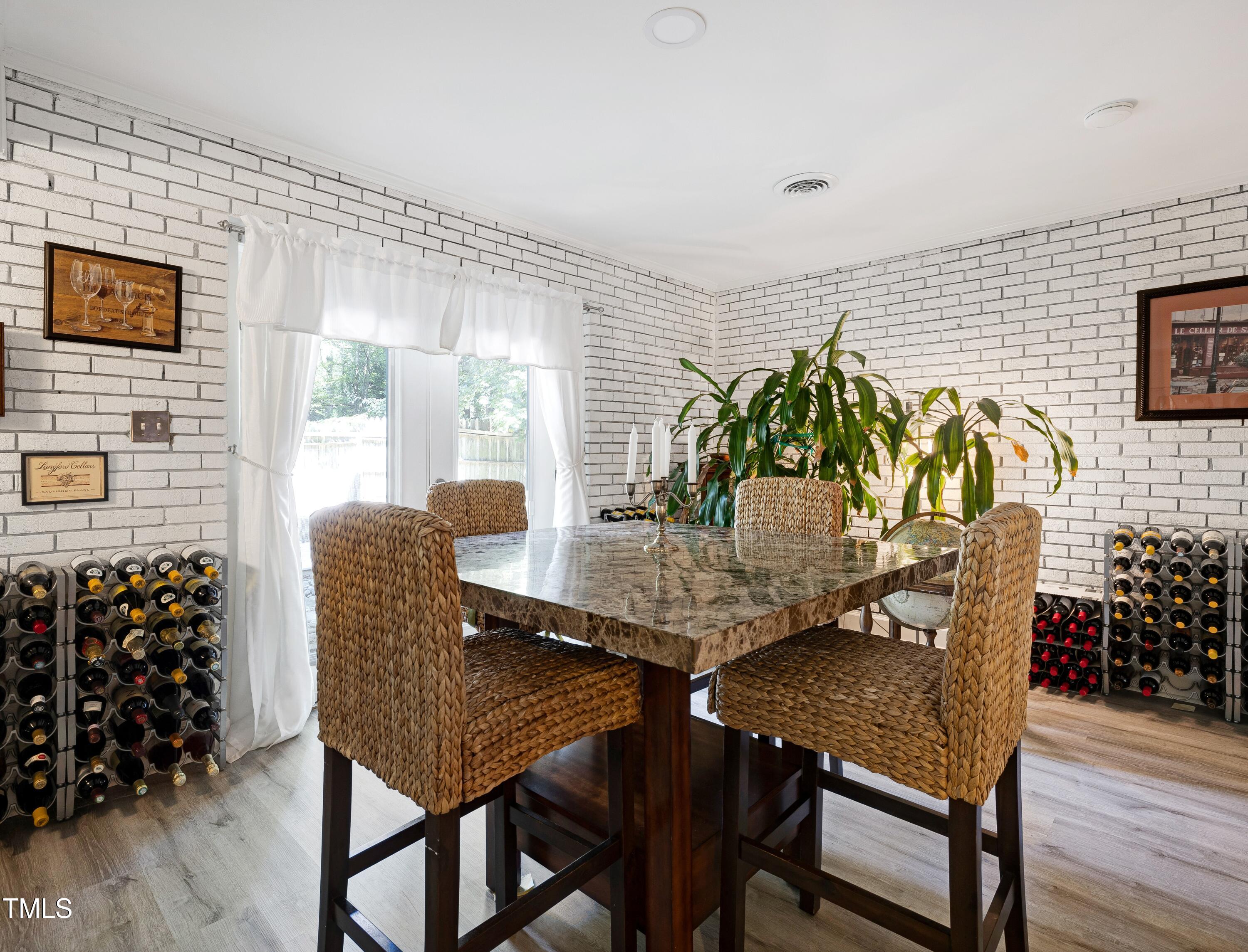 112 Queensferry Road Cary, NC 27511 - Photo 12 of 41 a view of a dining room with furniture and wooden floor