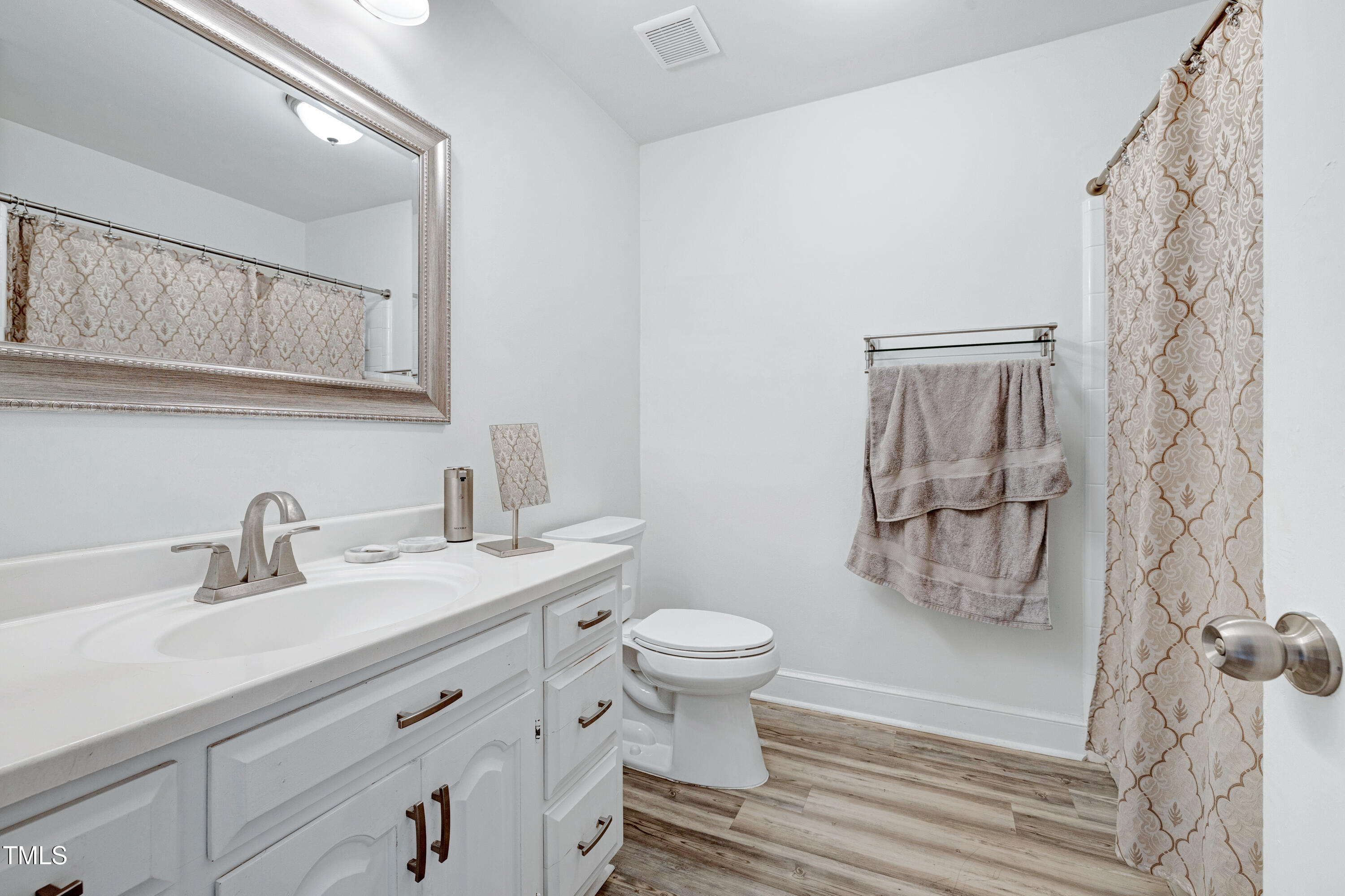 112 Queensferry Road Cary, NC 27511 - Photo 17 of 41 a bathroom with a sink toilet and shower