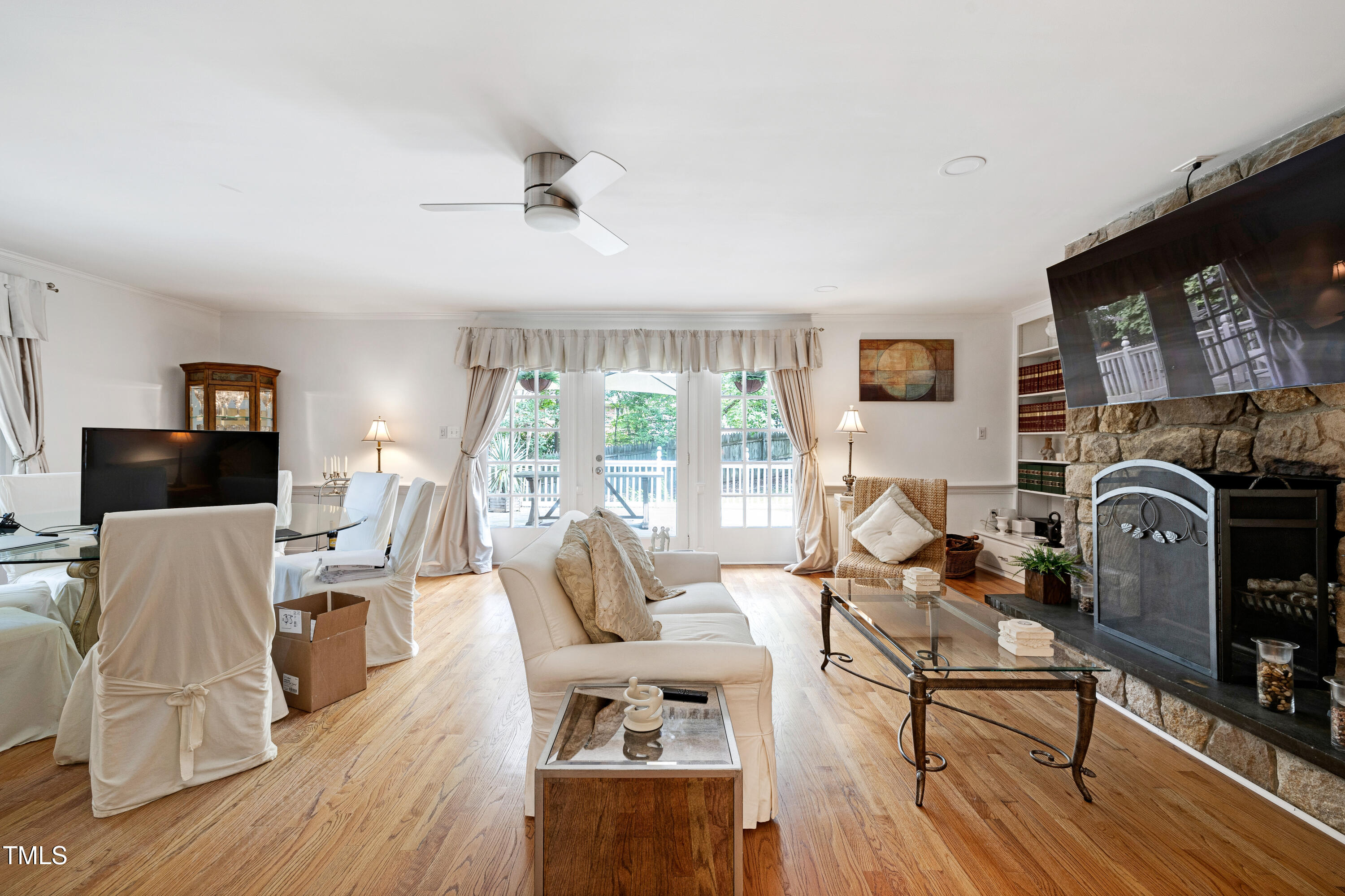 112 Queensferry Road Cary, NC 27511 - Photo 23 of 41 a living room with furniture a flat screen tv and a fireplace