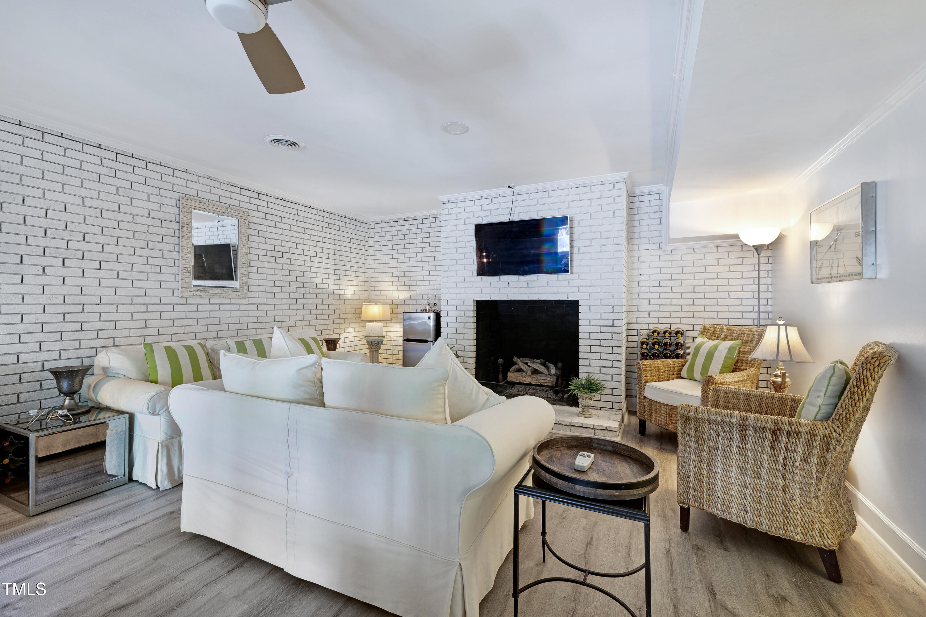 112 Queensferry Road Cary, NC 27511 - Photo 26 of 41 a living room with furniture and a fireplace