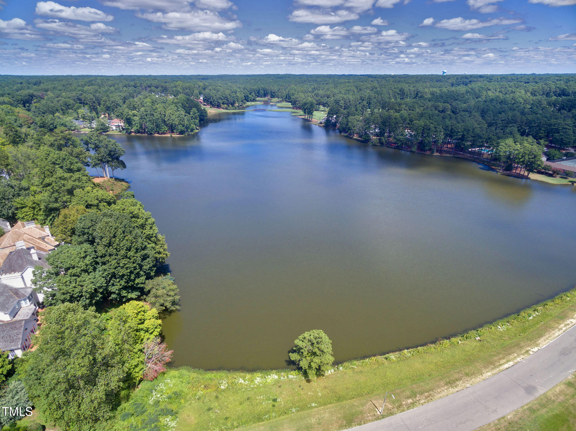 112 Queensferry Road Cary, NC 27511 - Photo 36 of 41 an aerial view of a house with a yard and lake view