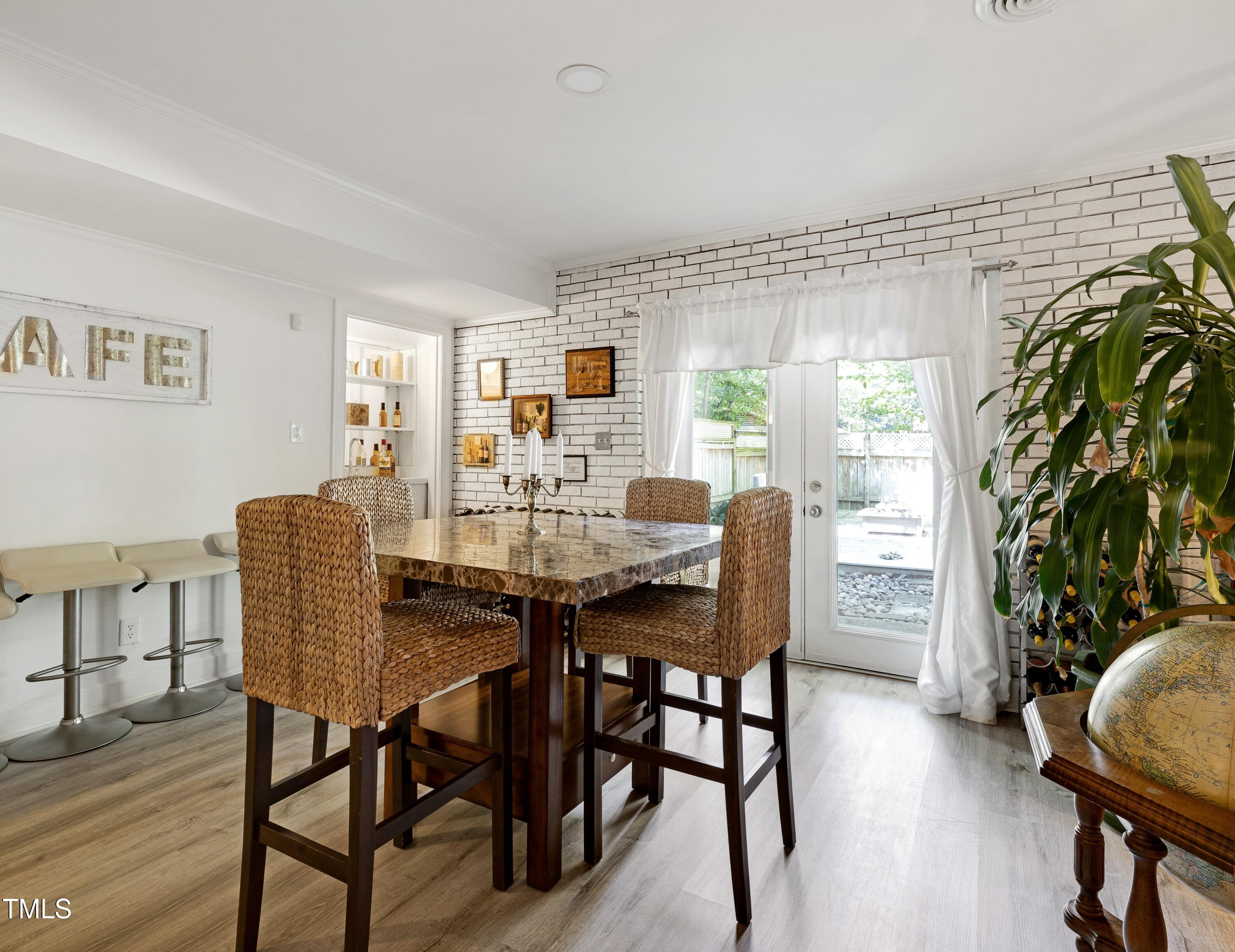 112 Queensferry Road Cary, NC 27511 - Photo 10 of 41 a view of a dining room with furniture and wooden floor