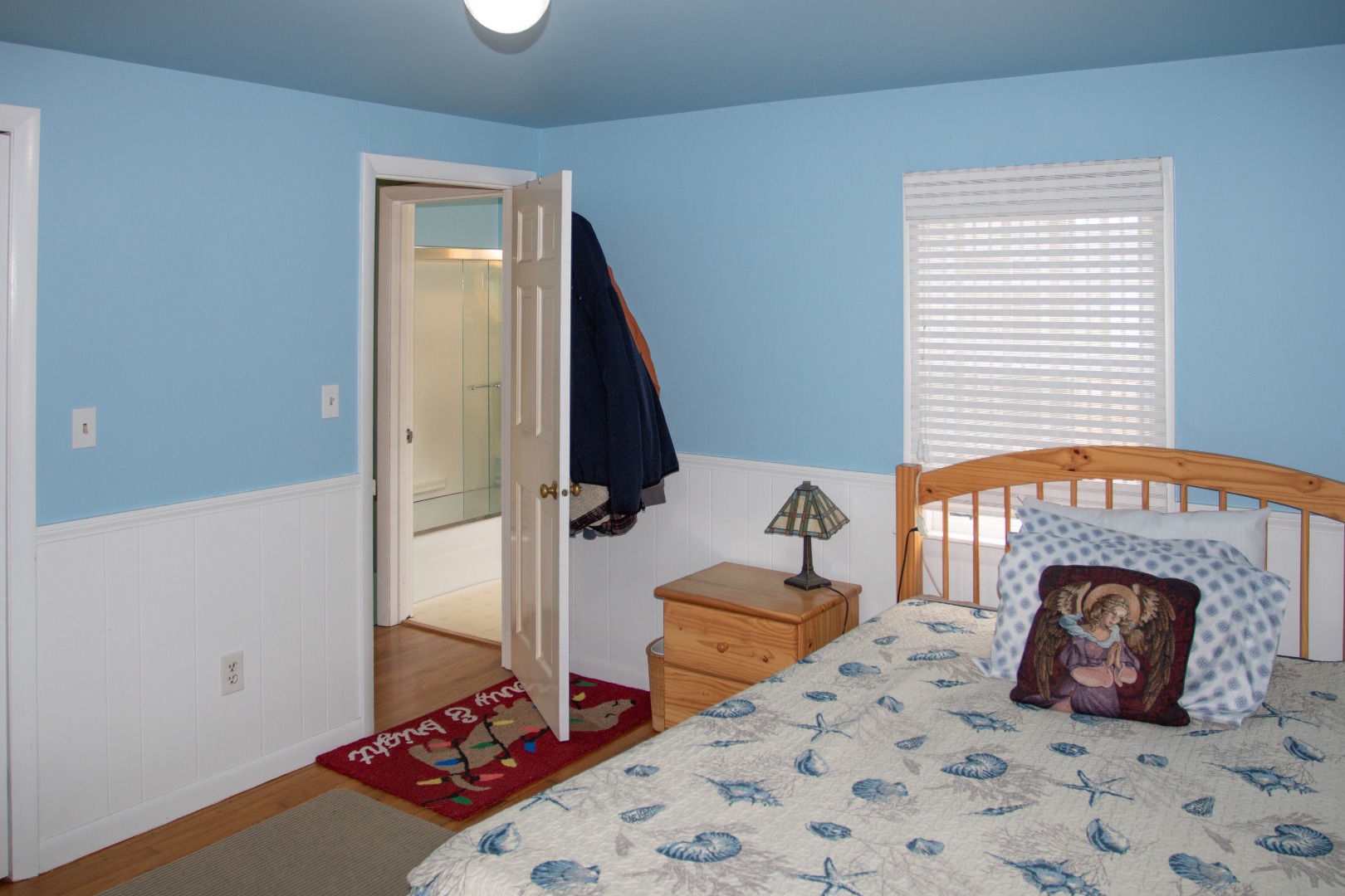 11 Newtown Road Nantucket, MA 02554 - Photo 12 of 20 a bedroom with a bed and a fireplace